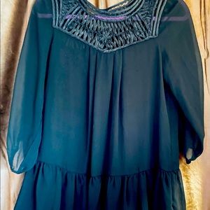 Sheer dressy black blouse.